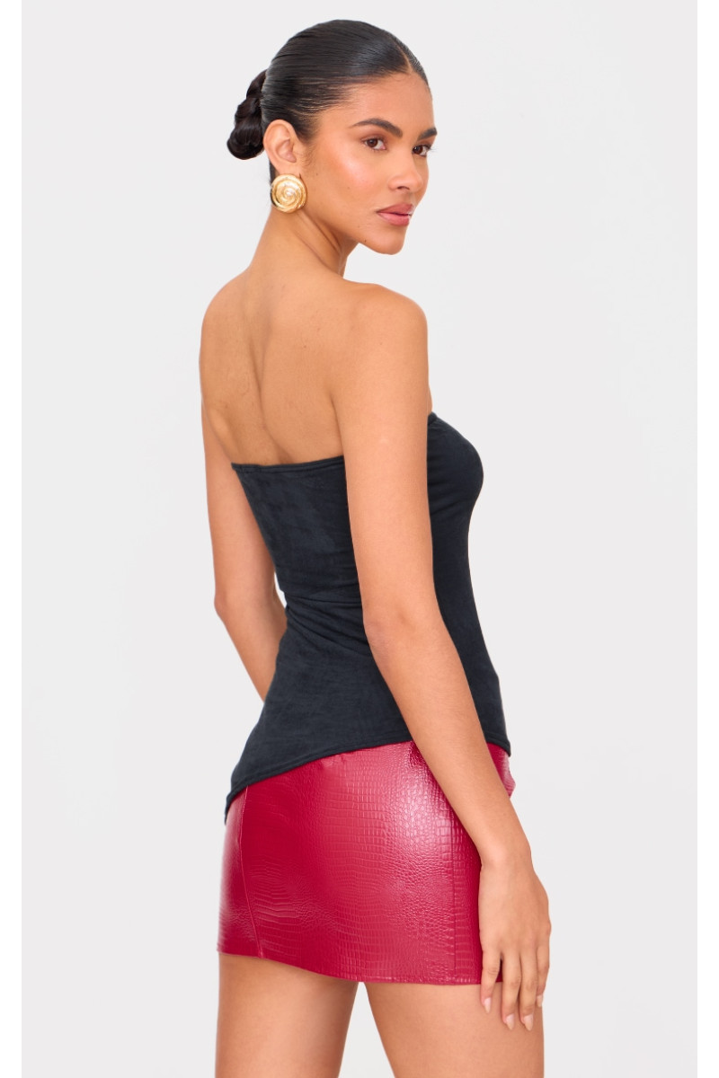 Чорний топ-бандо з штучної замші з асиметричним подолом